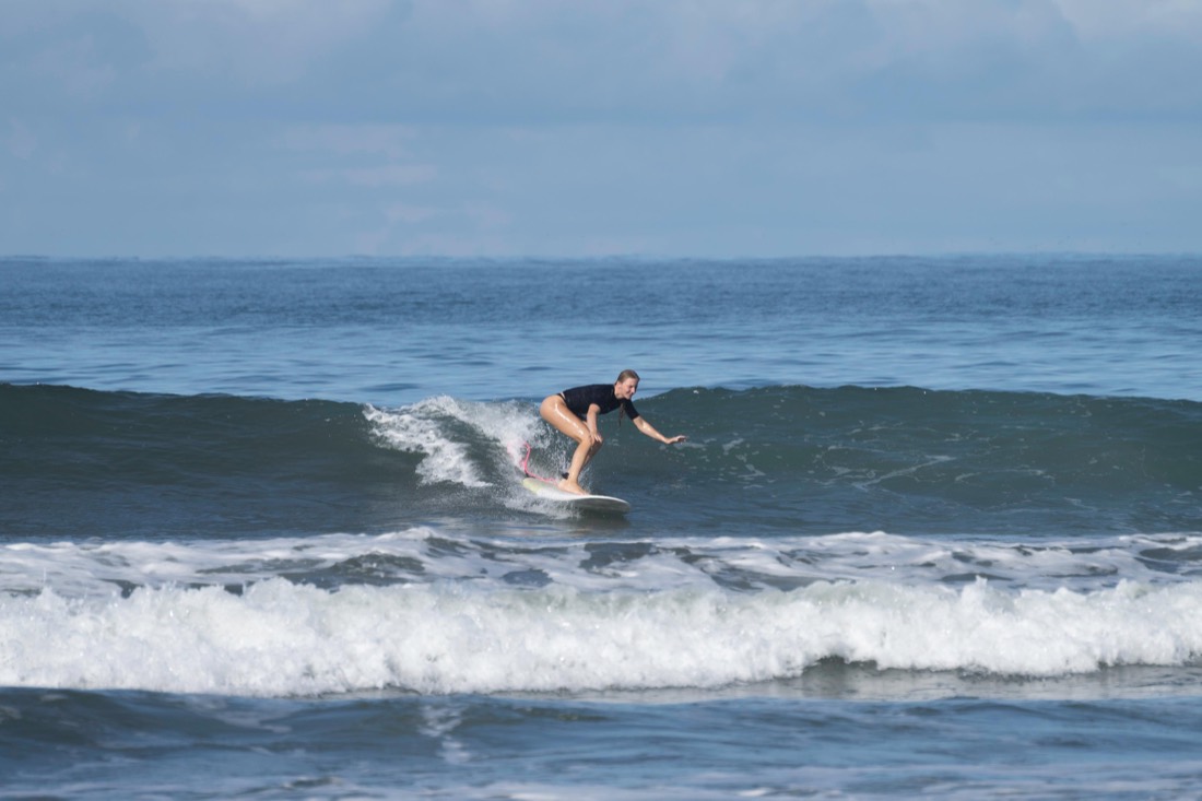 Riding down the line at Jacó Beach